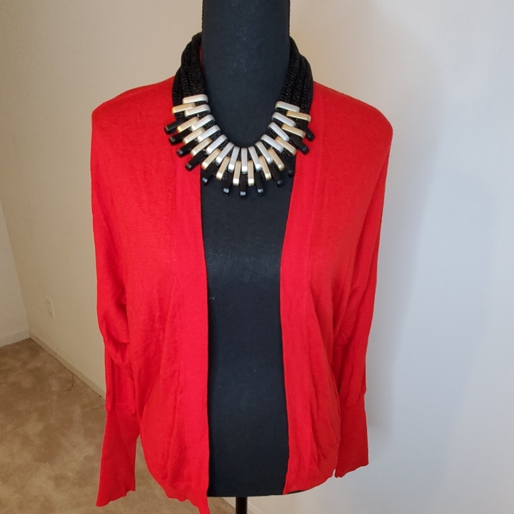 Red cardigan sweater knit material